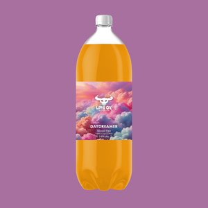2 litre PET bottle of Little Ox Daydreamer with a colorful label on a purple background